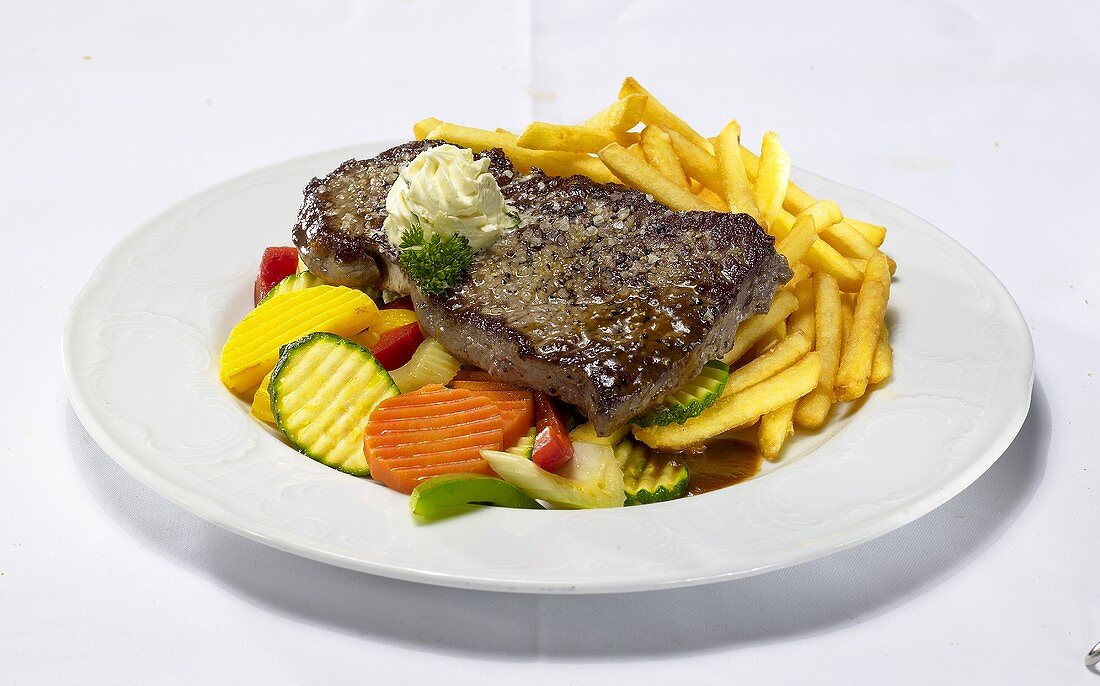 Rump steak with chips and summer vegetables