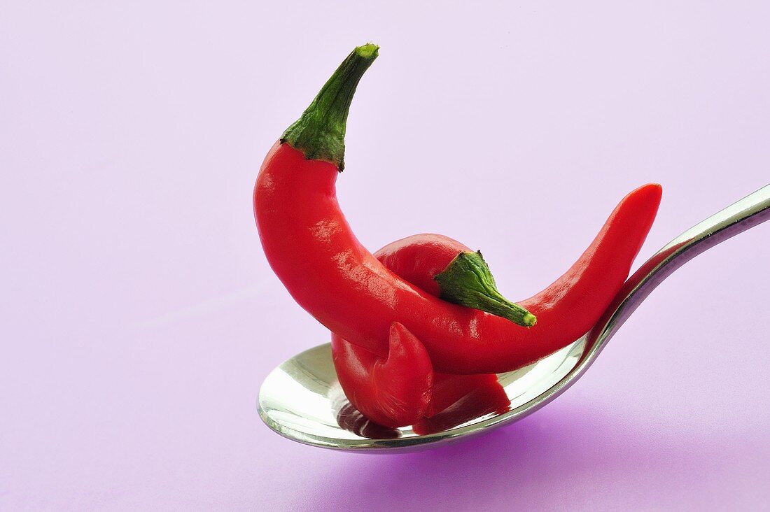 Fresh red chillies on spoon