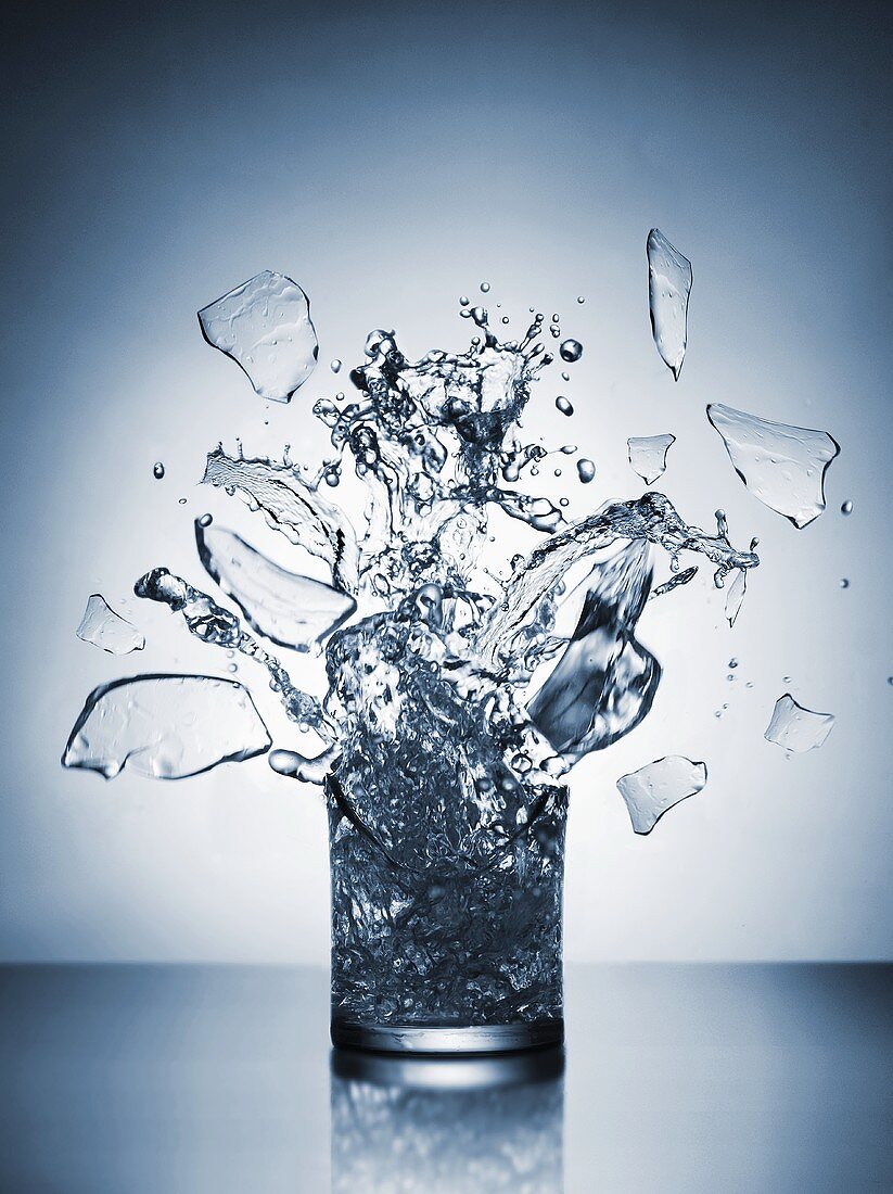 A glass of water shattering