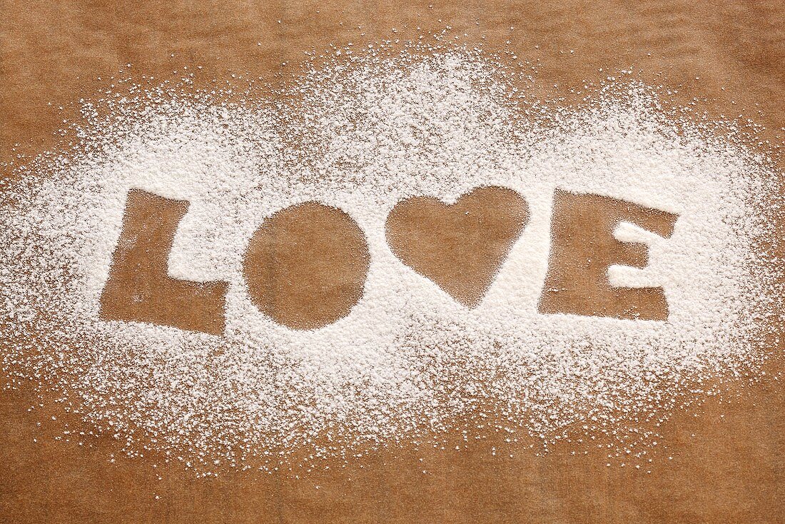 The word 'LOVE' in icing sugar