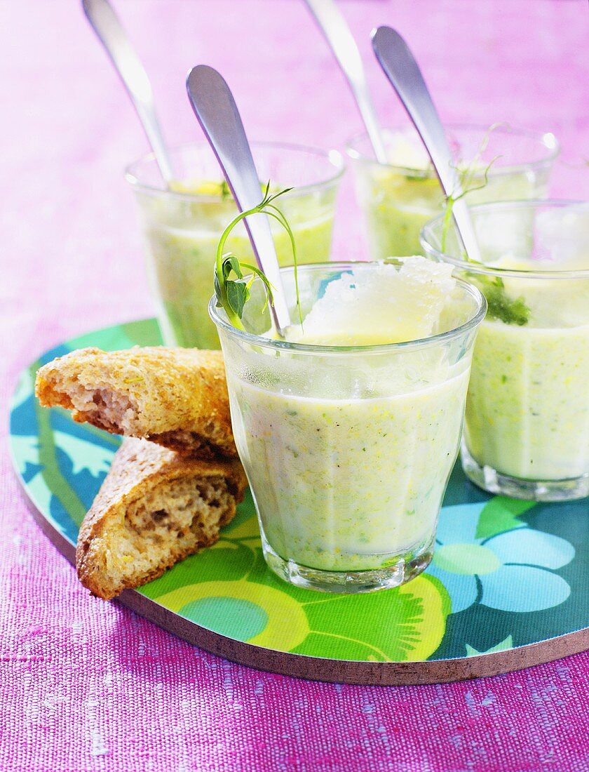 Pea soup with Parmesan in glasses