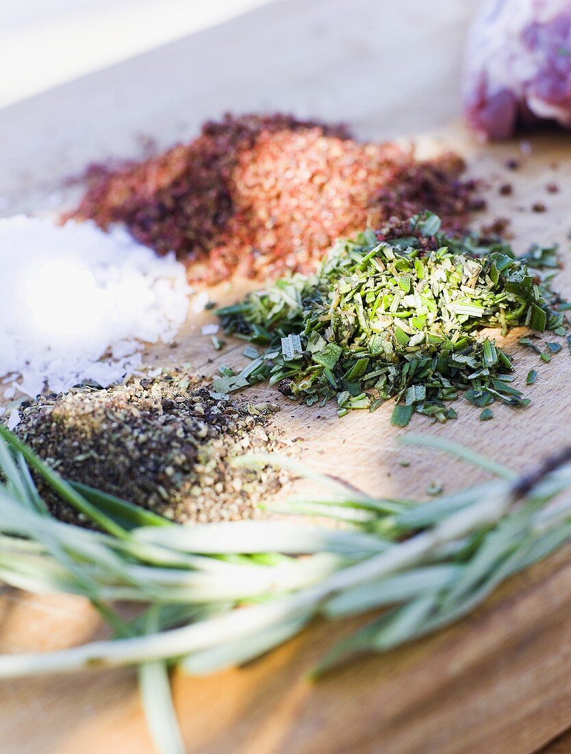 Chopped herbs and spices on chopping board