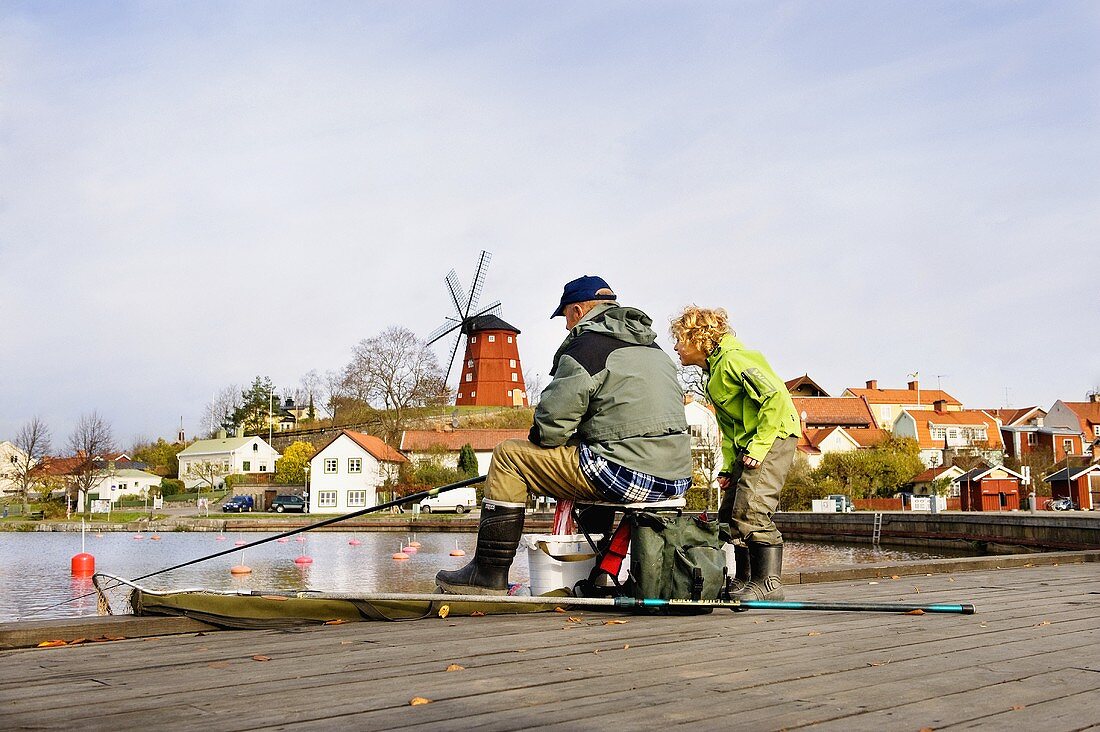 Grandfather and grandson fishing