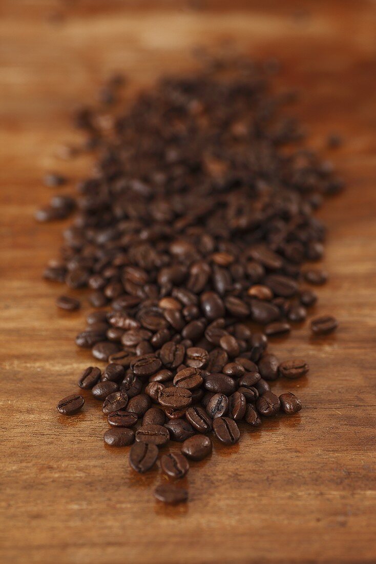 Coffee beans on wooden table