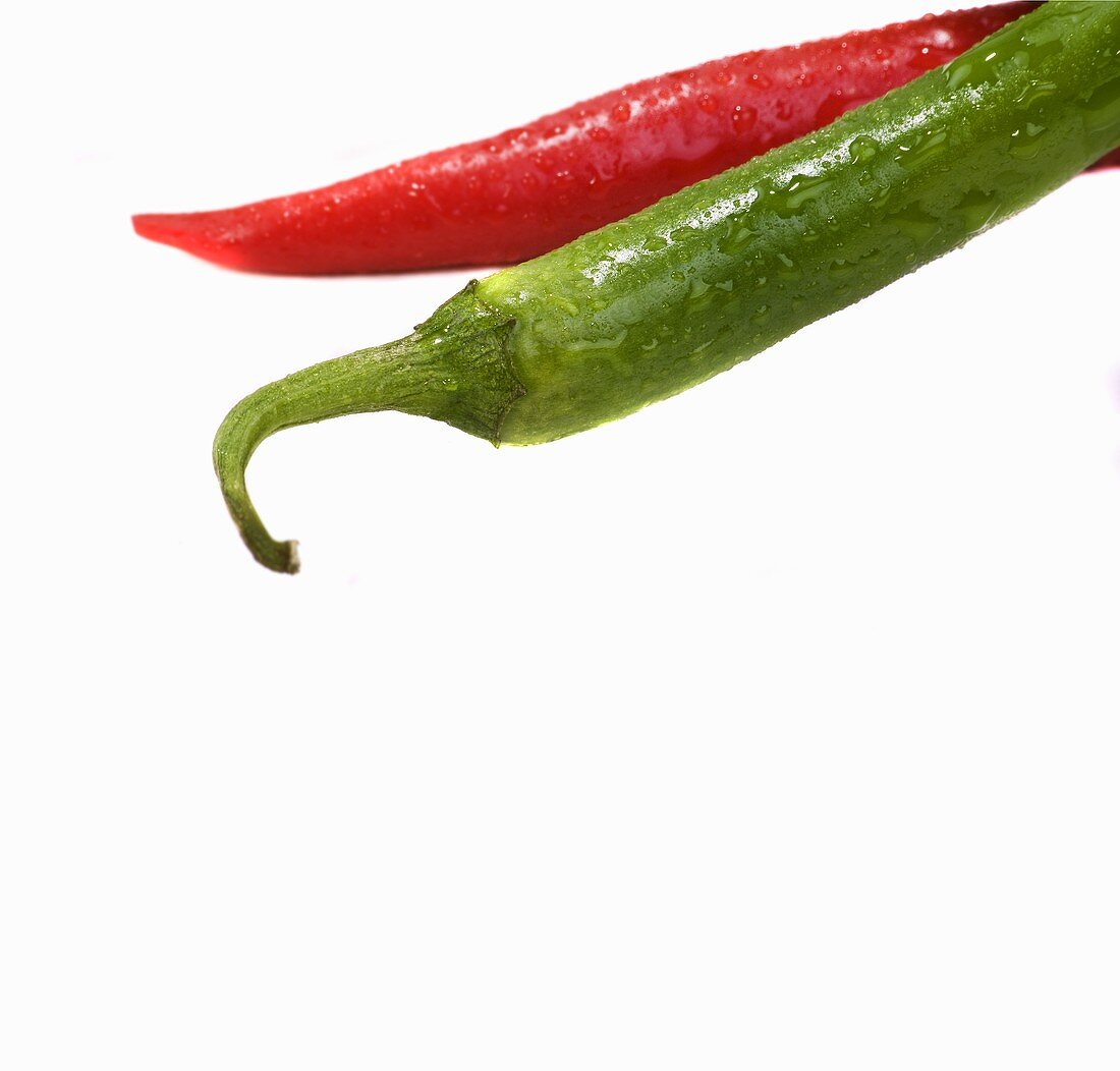 Red and green chillies with drops of water