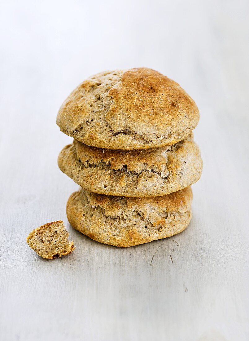 Three bread rolls, stacked