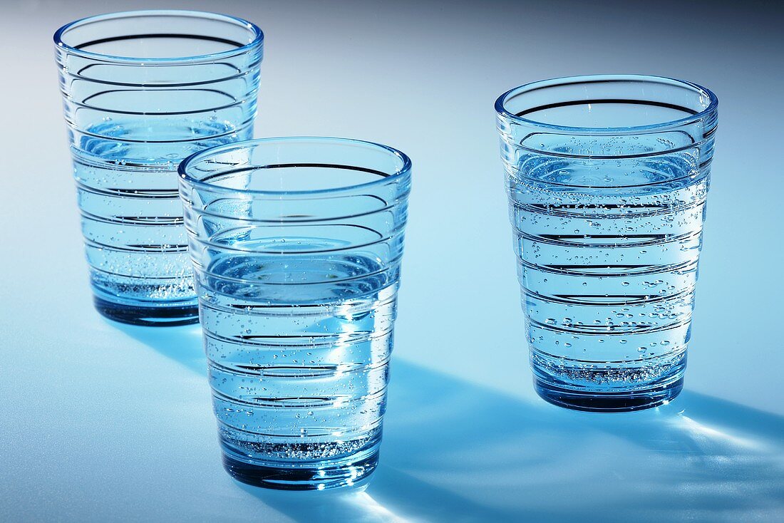 Three glasses of mineral water