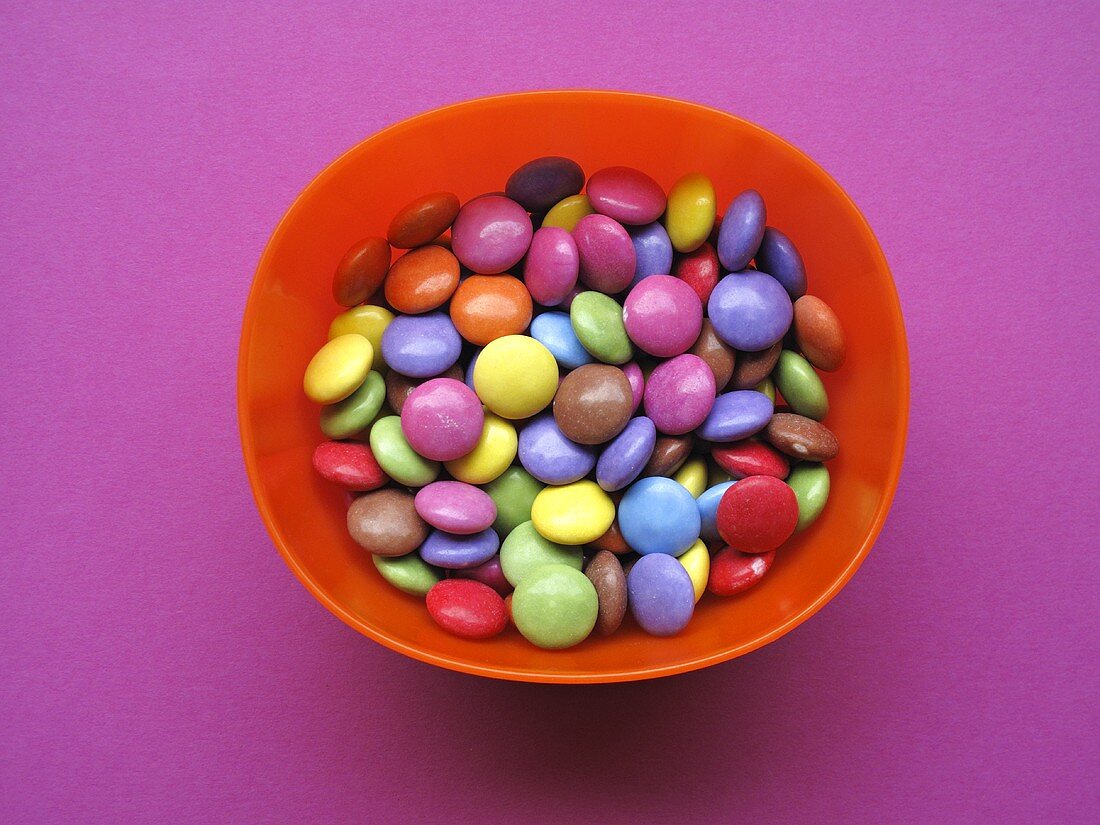 Coloured chocolate beans in a dish