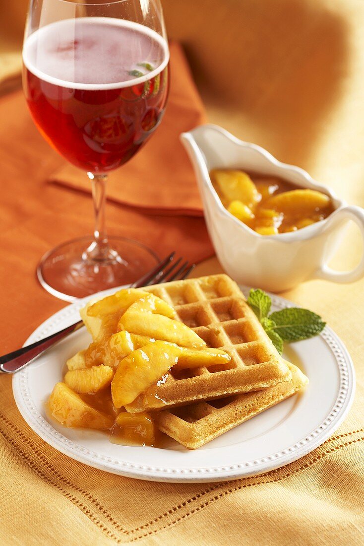 Waffles with Peach Topping; Cranberry Fizz