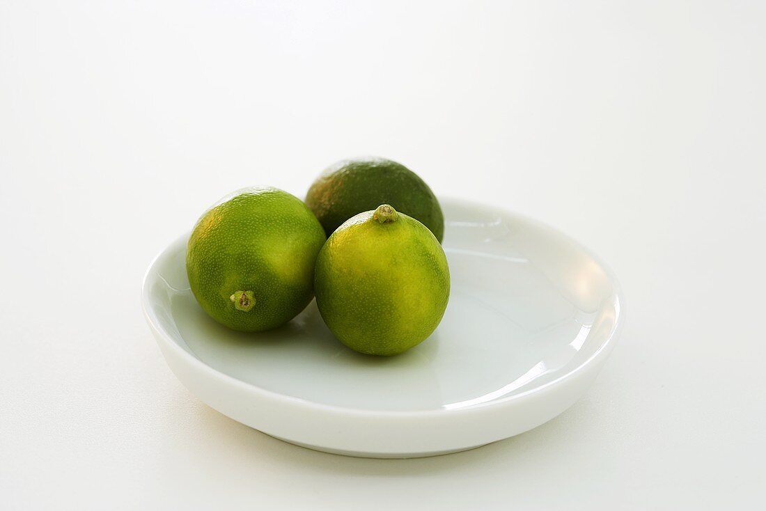 Three limes on plate