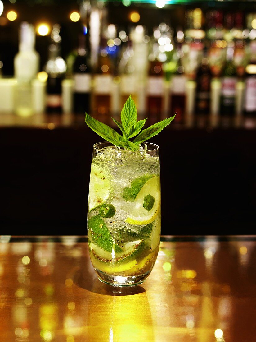 A glass of Mojito on a bar