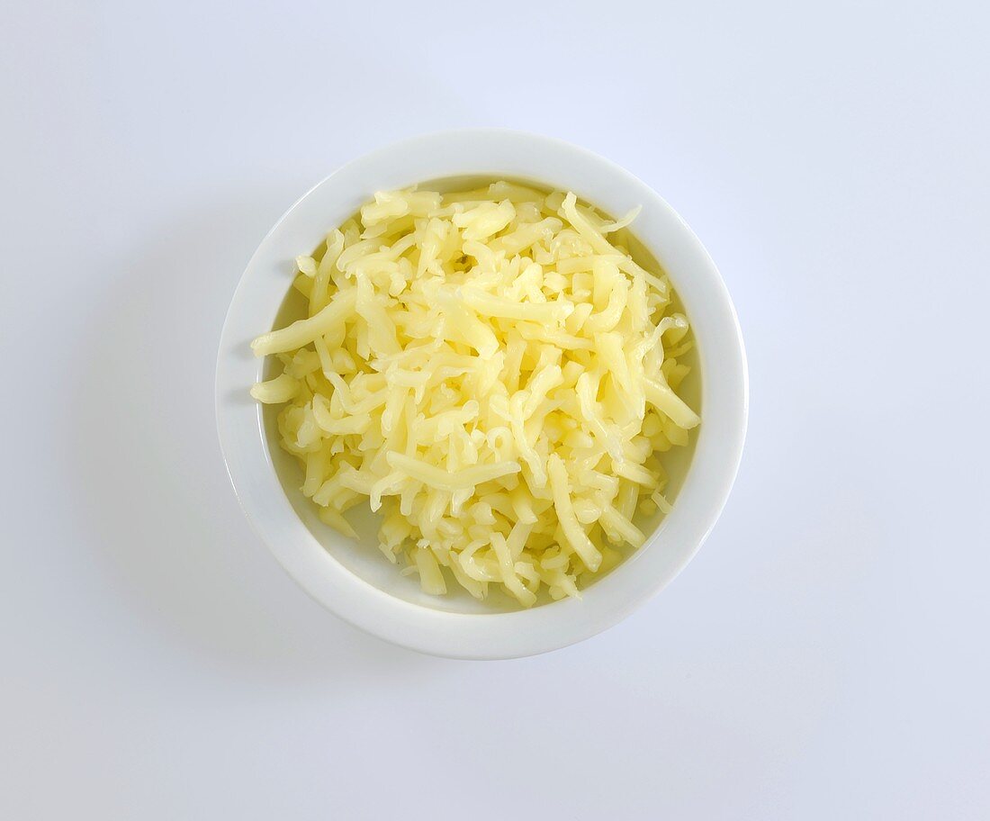 A dish of grated cheese (overhead view)