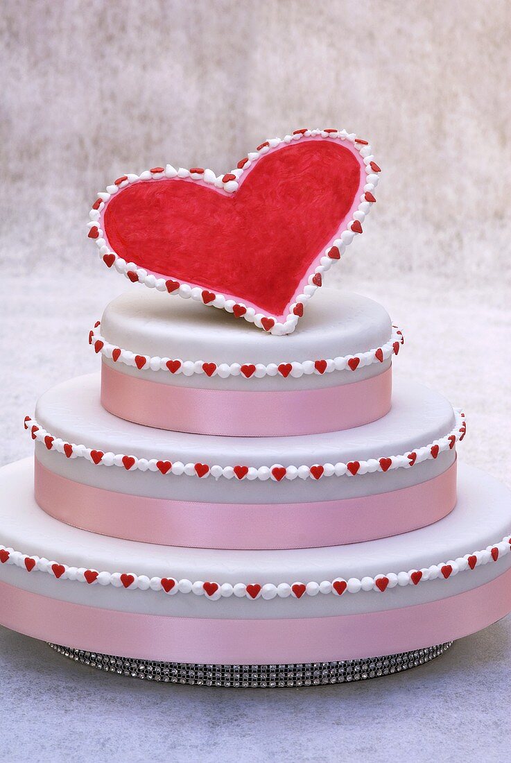 Three-tiered cake with red heart
