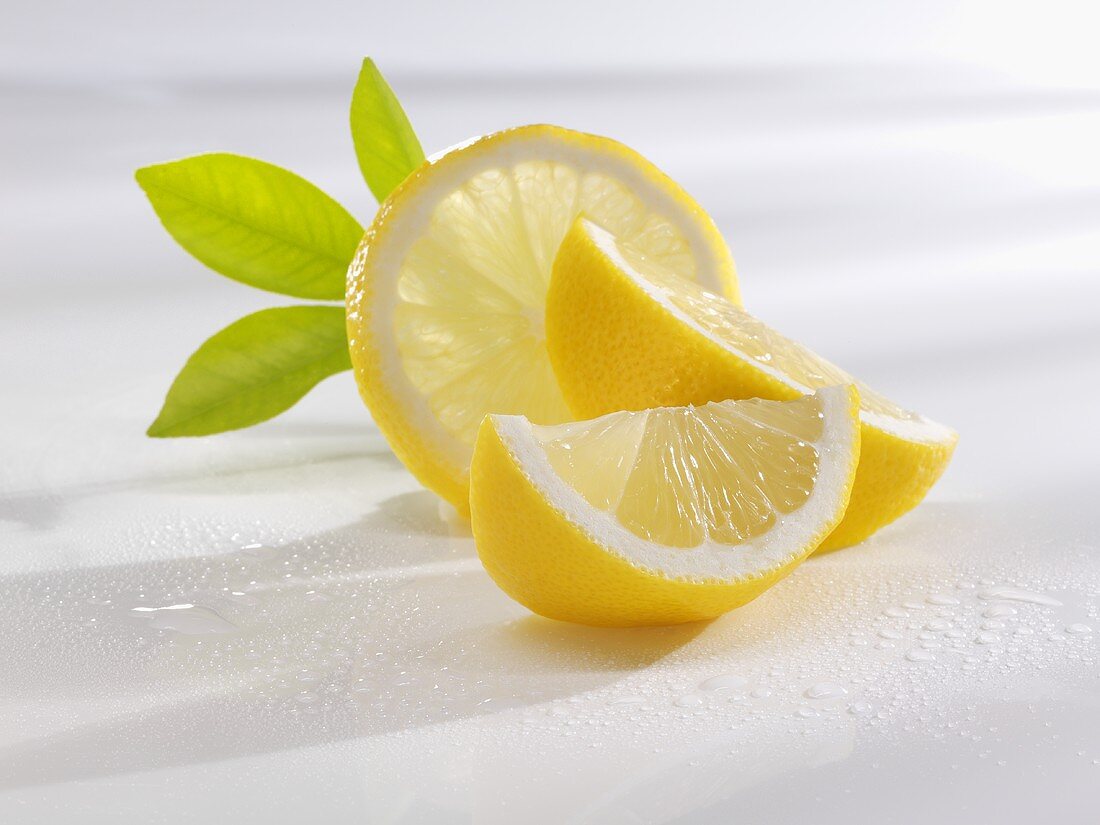 Slice of lemon and lemon wedges