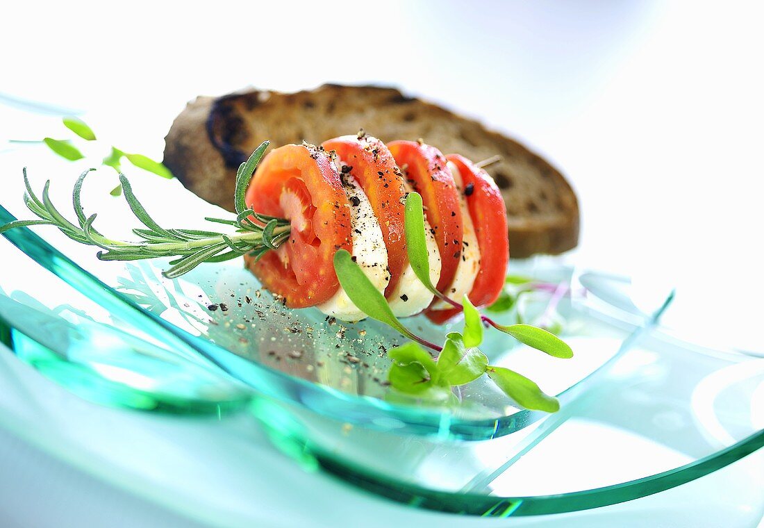 Tomato slices and mozzarella on rosemary skewer