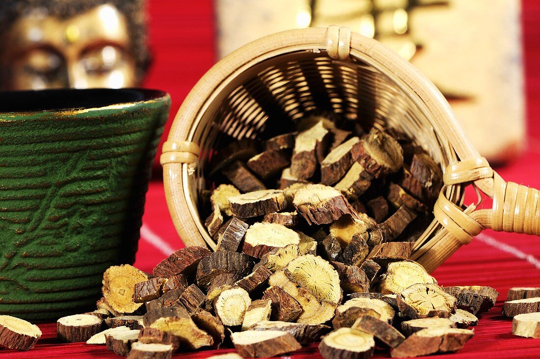 Dried Ural liquorice root in tea strainer for making tea