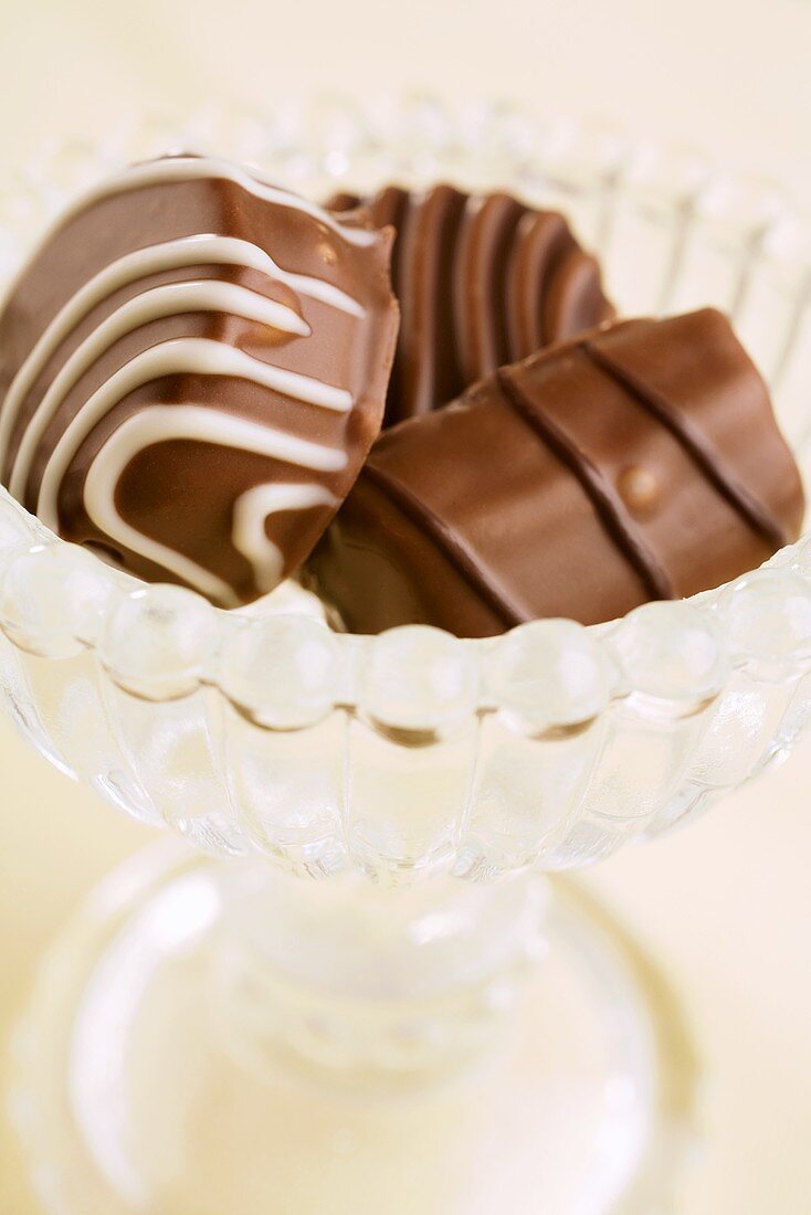 Chocolate pralines in a glass bowl