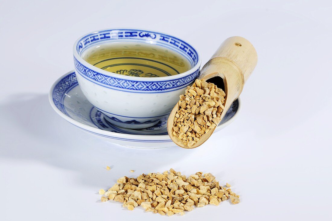 Bowl of tea and dried water plantain root (Ze Xie, China)