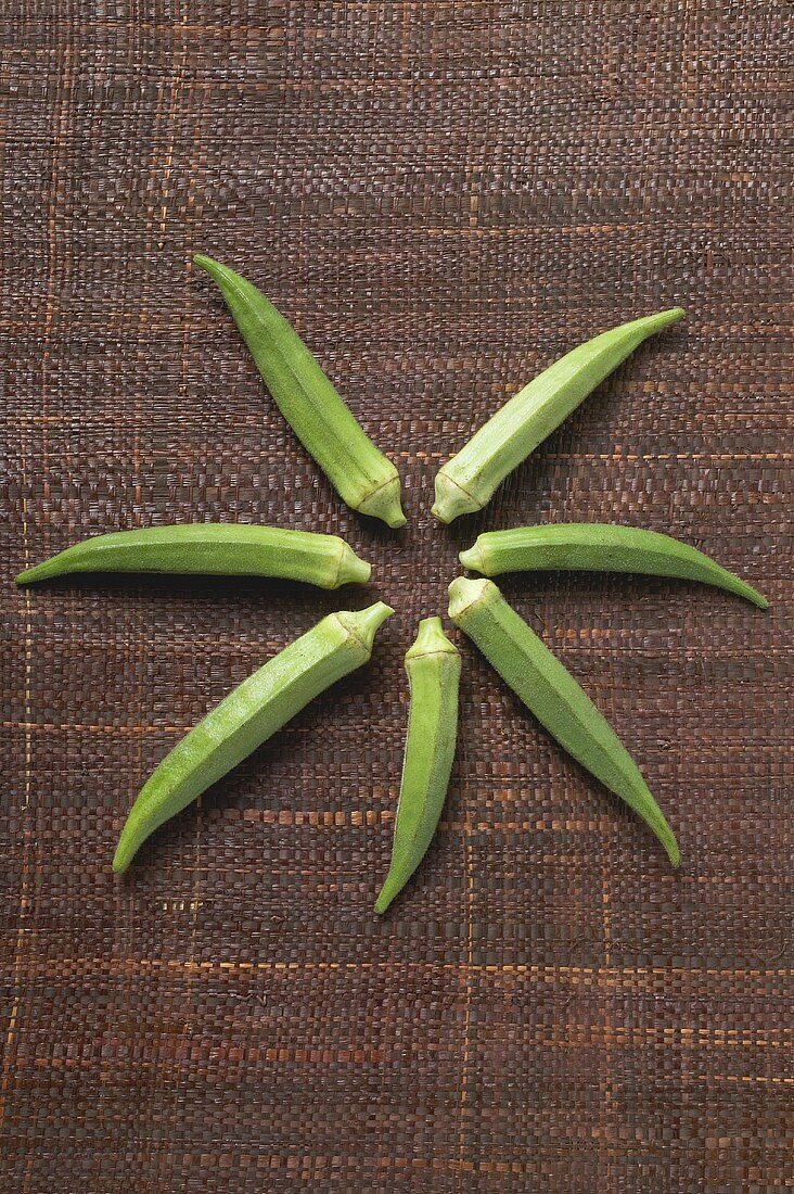 Seven okra pods arranged in a star shape