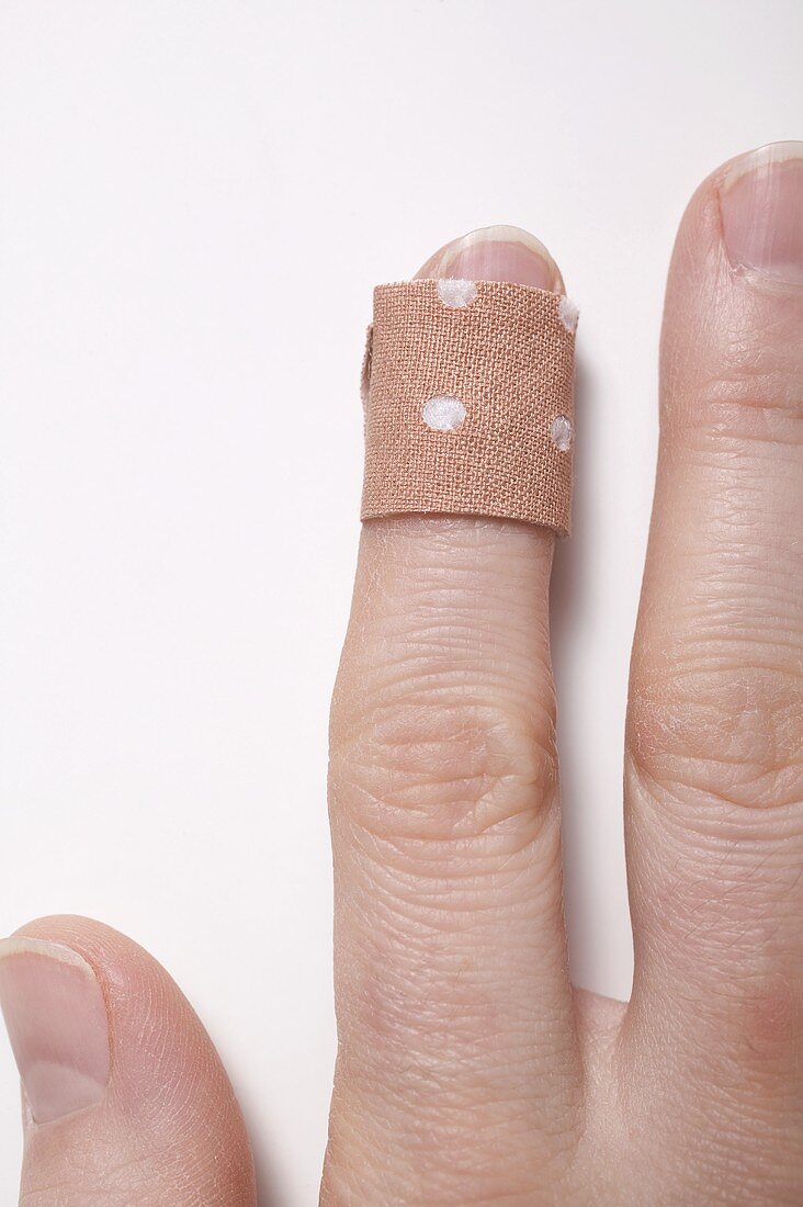 Finger with sticking plaster