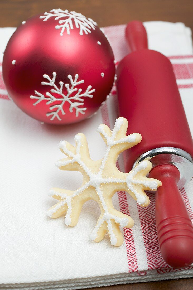 Christmas biscuit, rolling pin and Christmas bauble