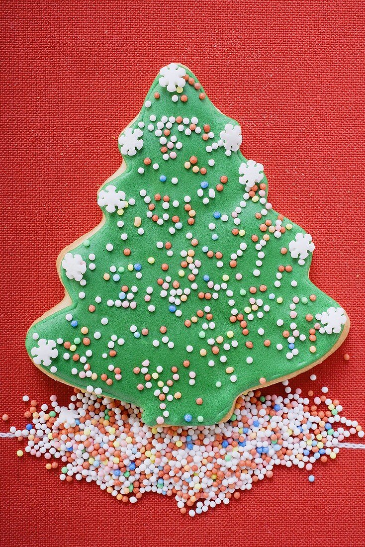 Christmas tree biscuit with coloured sprinkles