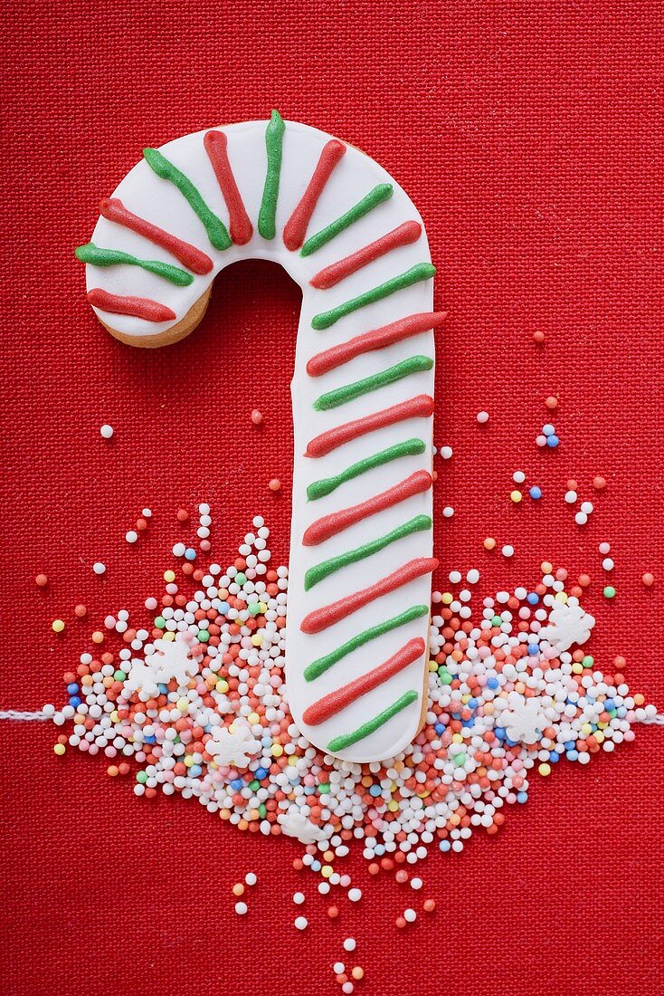 Candy cane biscuit with coloured sprinkles