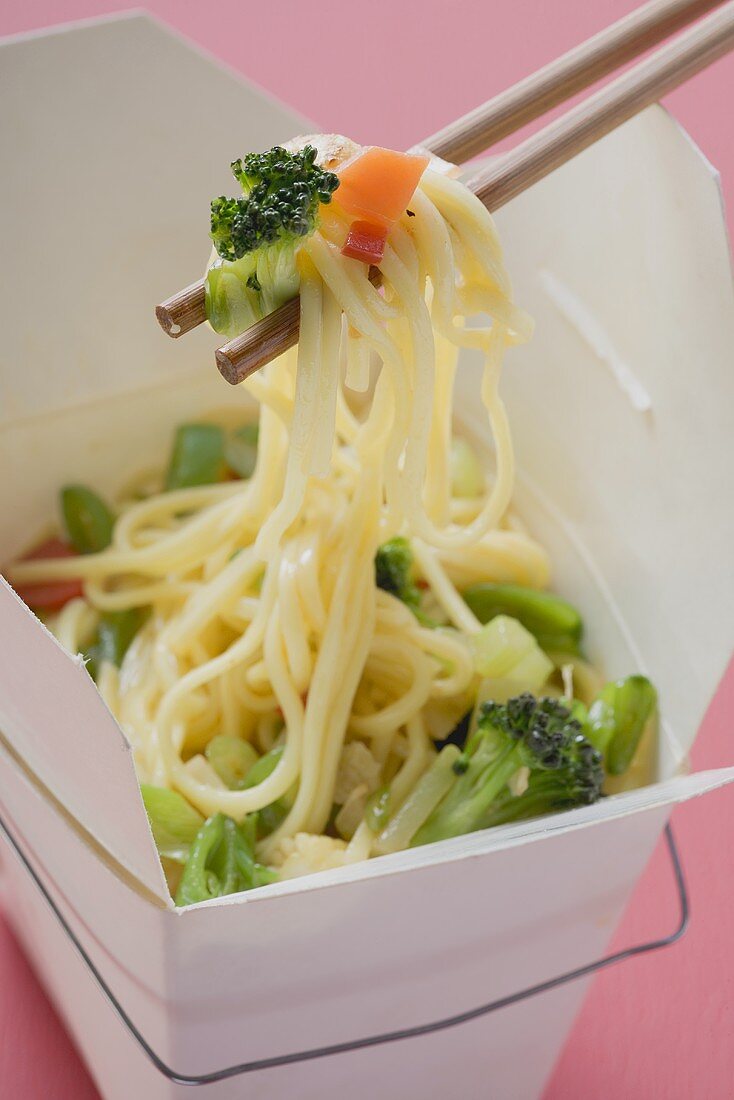 Noodles with vegetables in take-away container