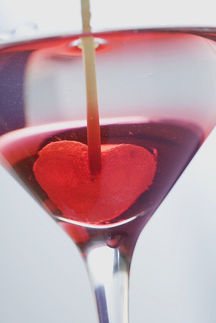 Martini with jelly heart in glass (close-up)