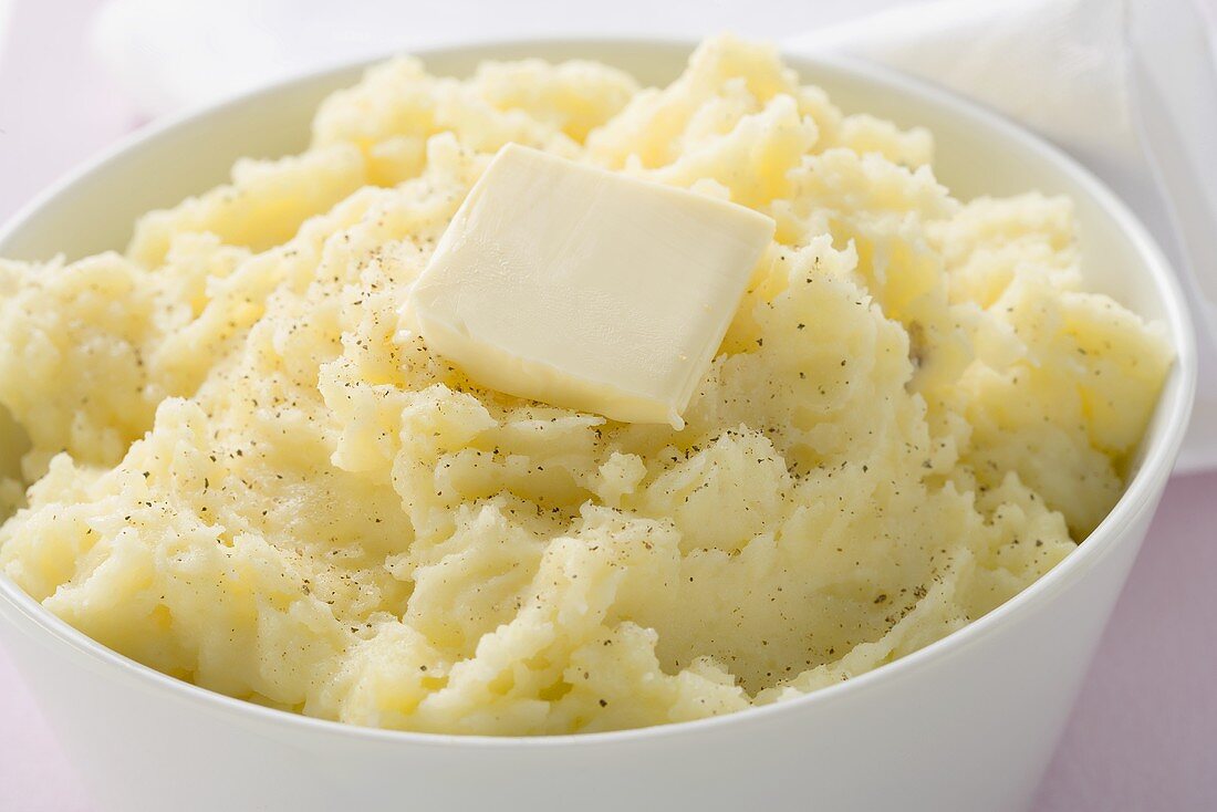 Mashed potato with a knob of butter (close-up)