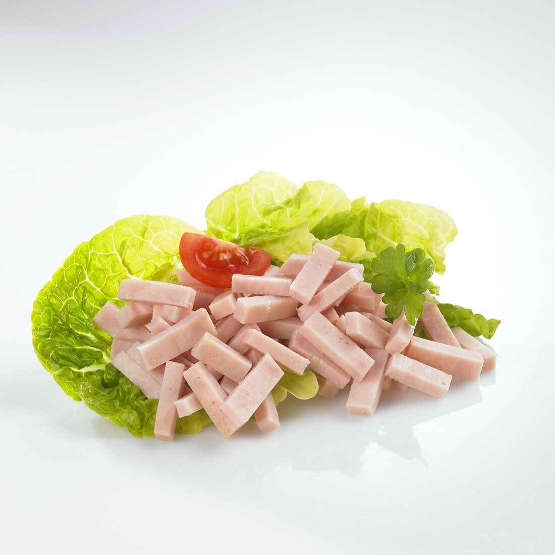 Strips of turkey on lettuce leaves