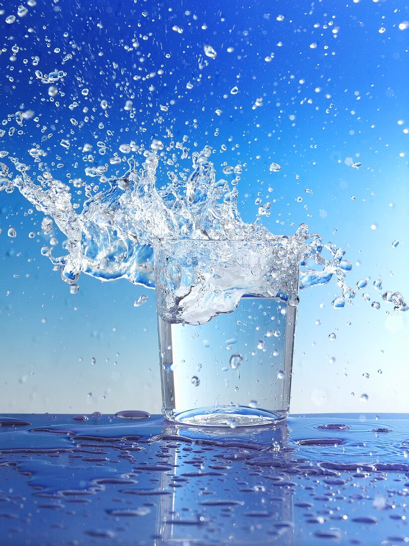 Water splashing out of glass