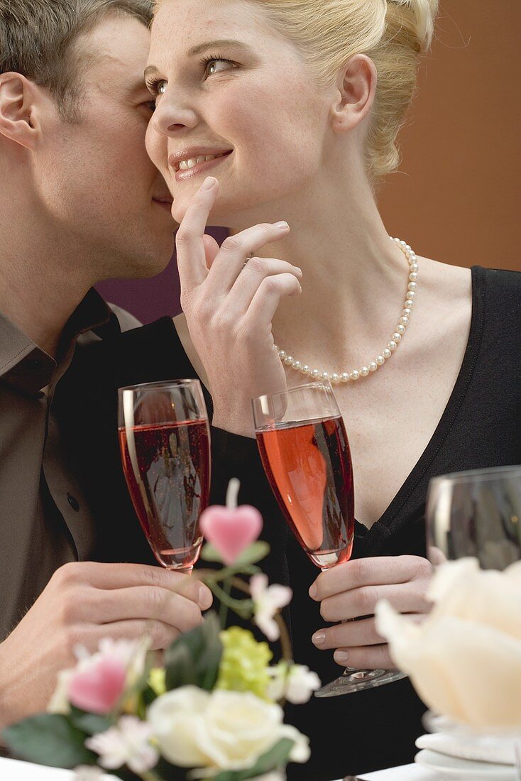 Romantic couple with glasses of sparkling wine