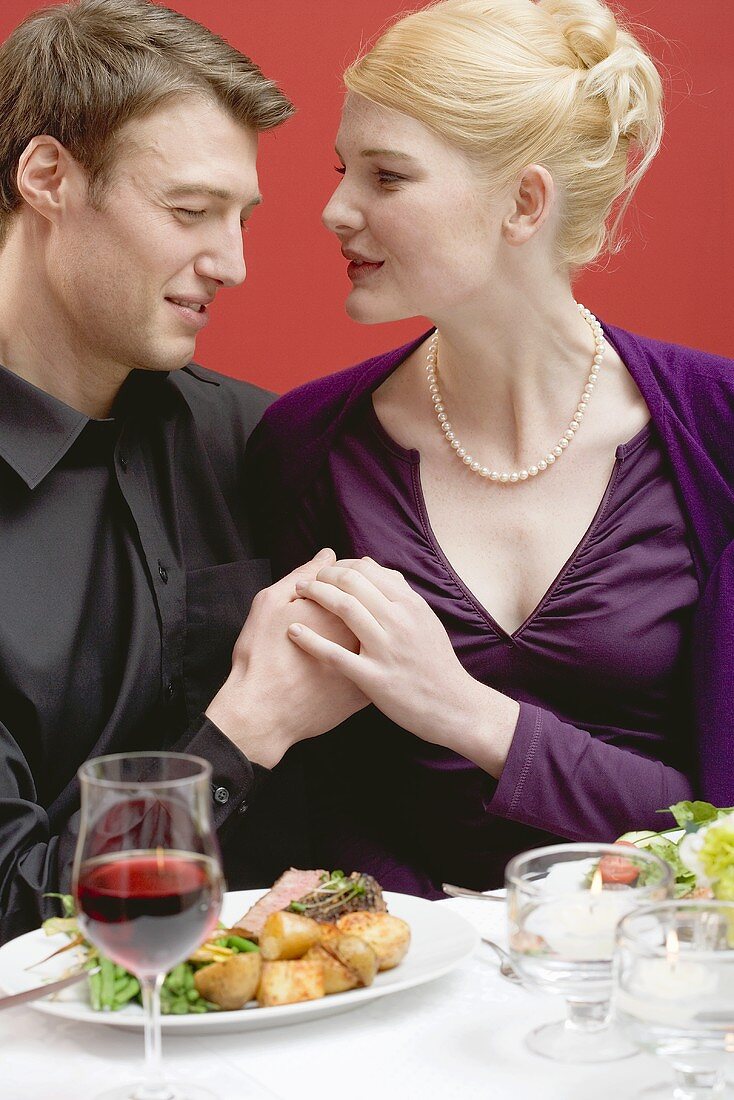 Elegant couple eating in a restaurant