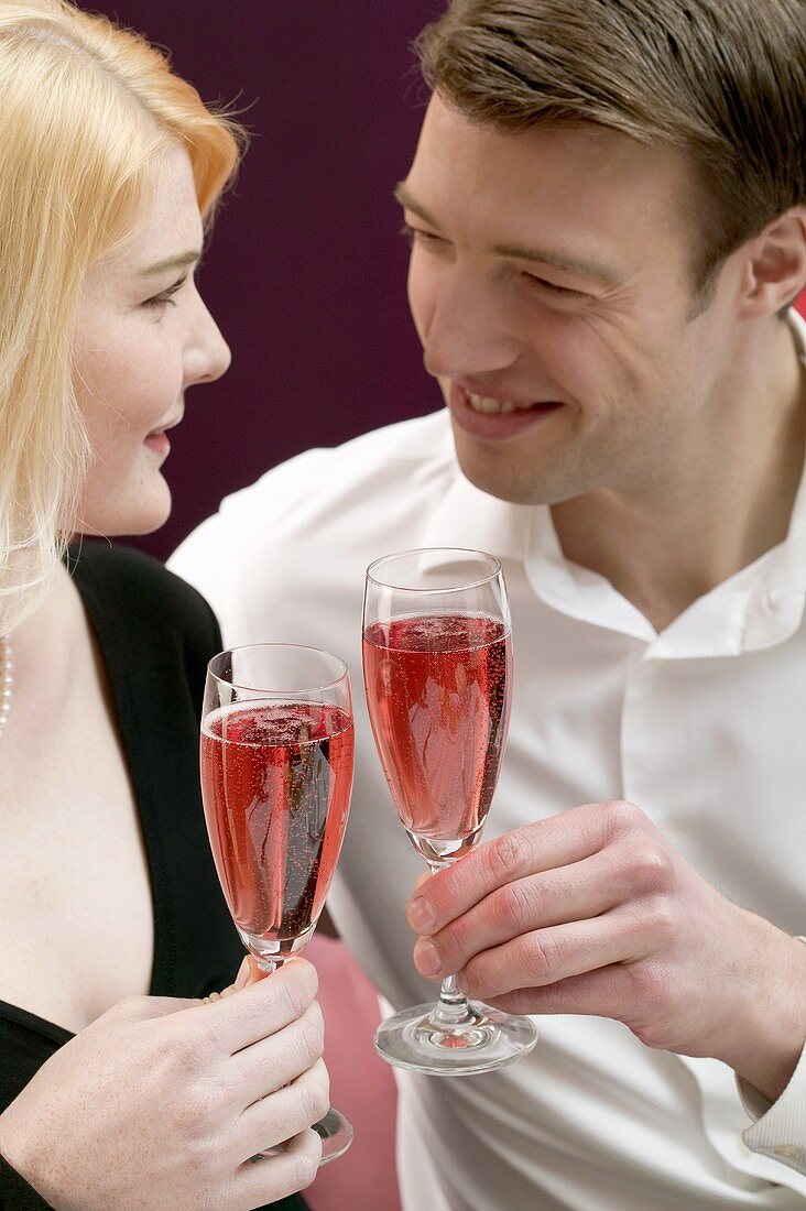 Couple clinking glasses of sparkling wine