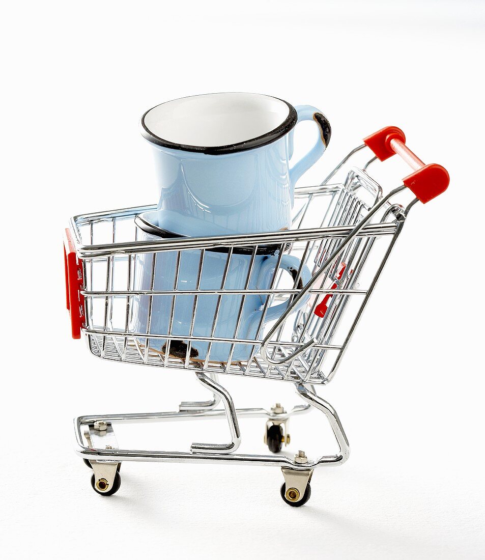 Two cups in toy shopping trolley