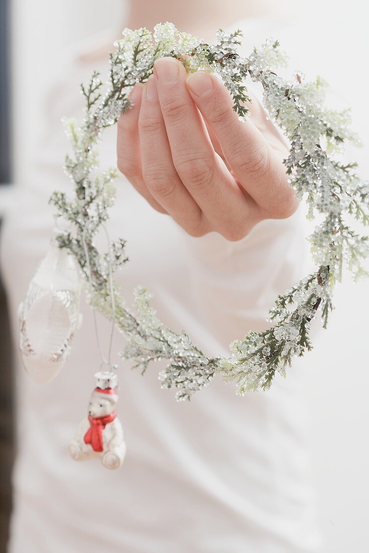 Woman holding Christmas decoration