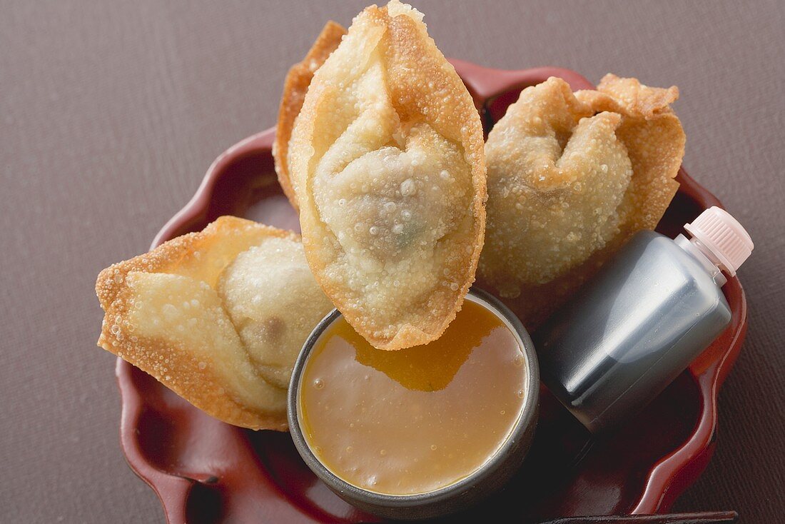 Deep-fried dim sum with two sauces (Asia)