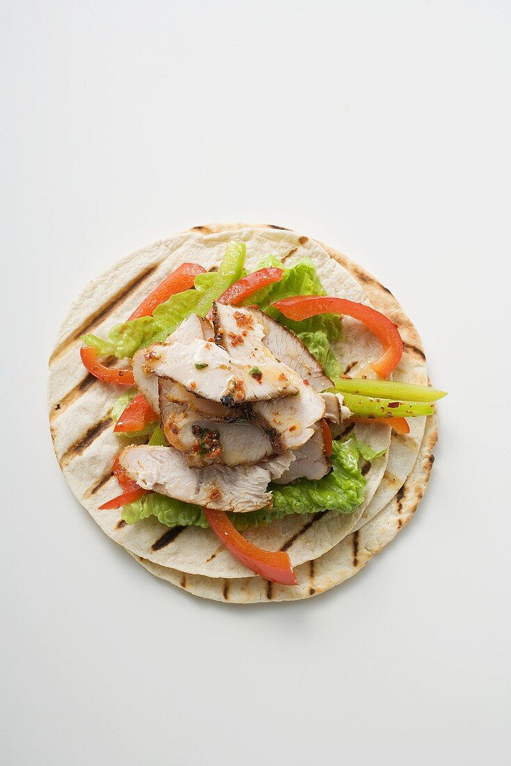 Grilled tortillas with chicken and peppers (overhead view)