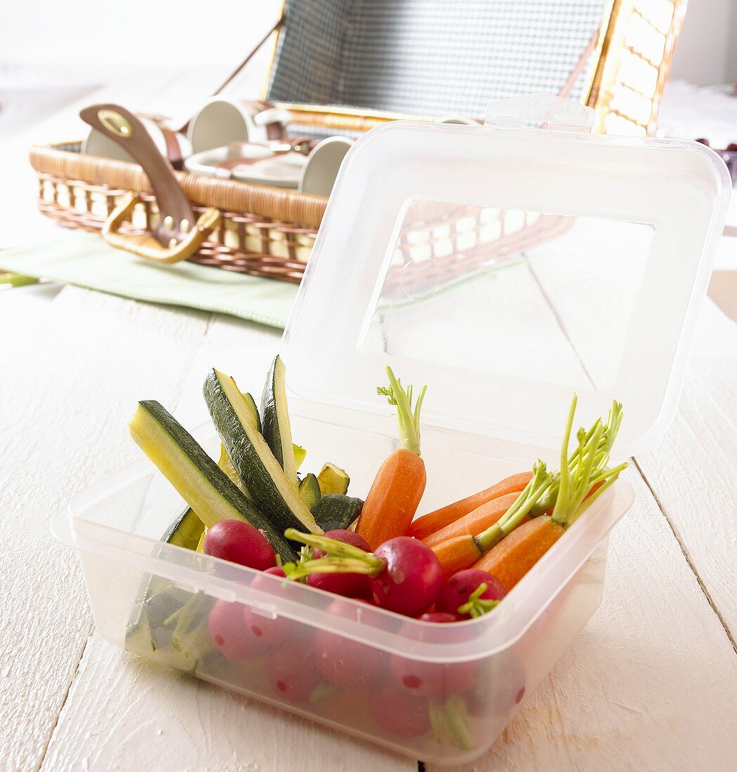 Raw vegetables in plastic container for a picnic