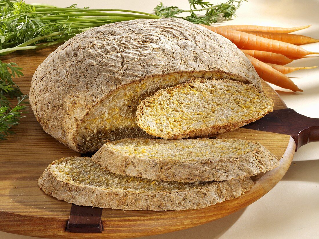 Carrot and sesame bread, partly sliced