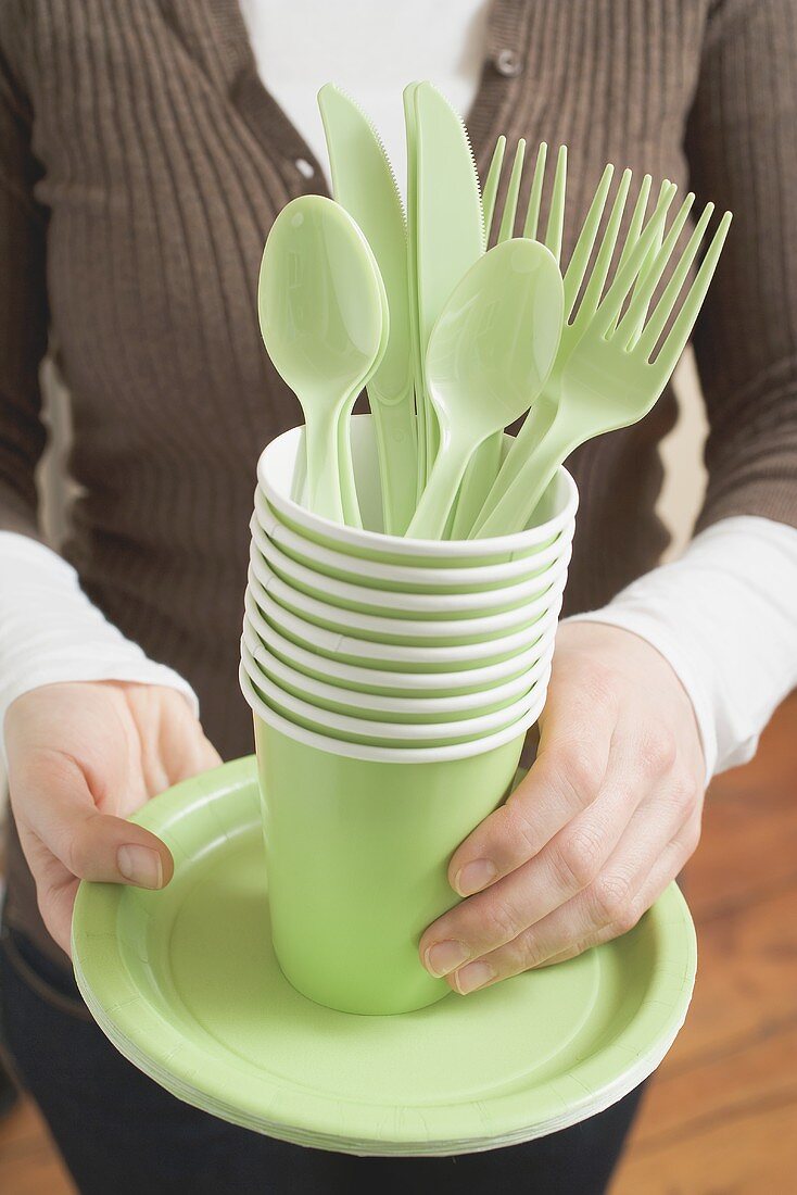 Woman holding picnicware