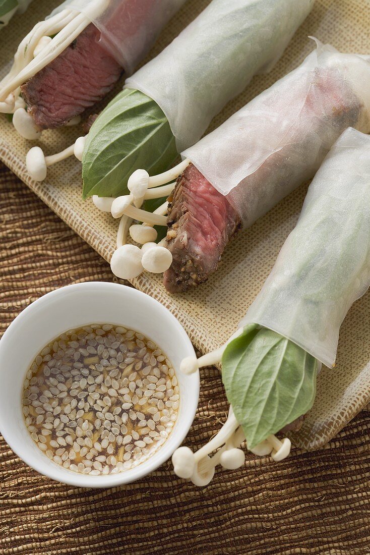 Rice paper rolls rilled with beef & mushrooms, sesame sauce