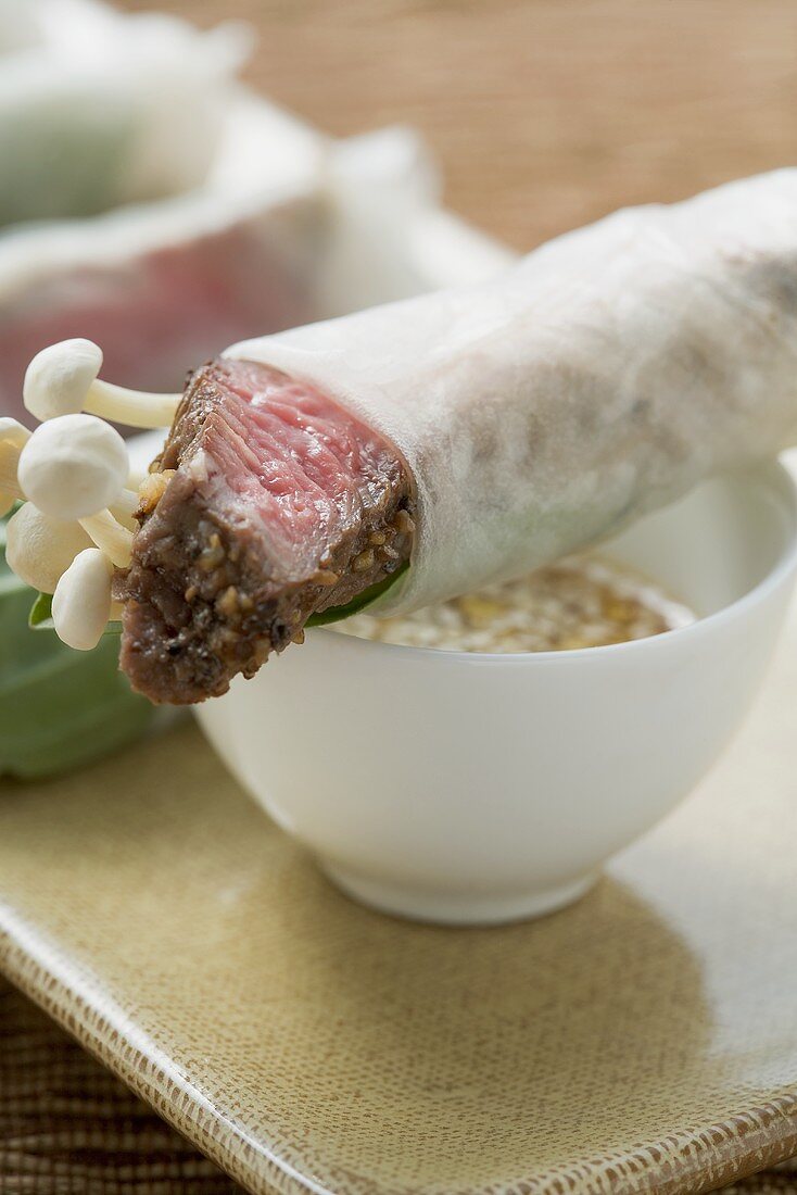 Rice paper rolls filled with beef & mushrooms, sesame sauce