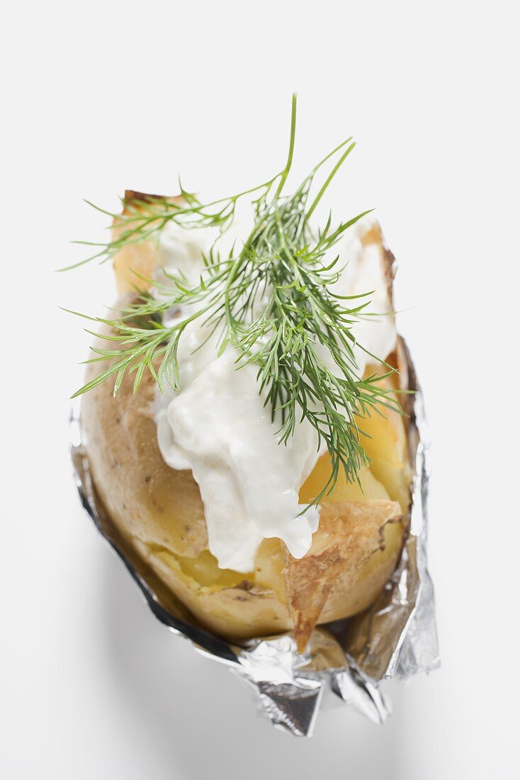 Baked potato with sour cream and dill