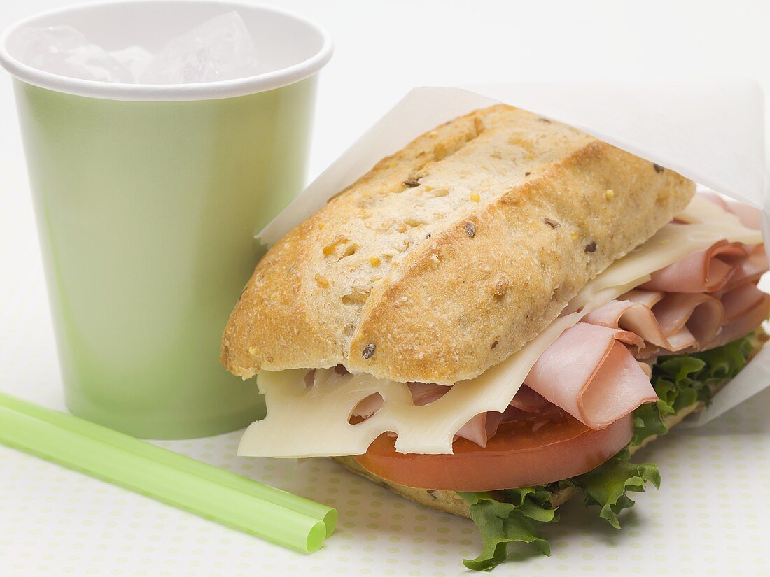 Ham, cheese, lettuce and tomato sandwich, drink