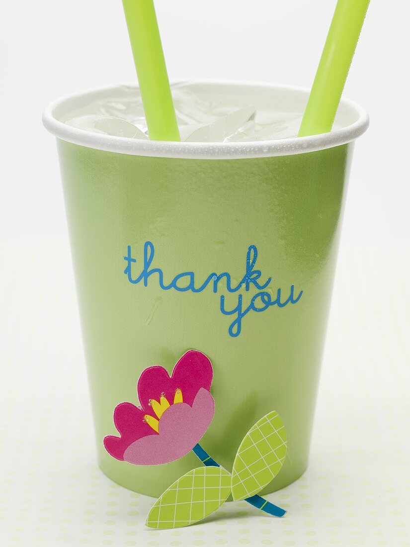 Iced water in cup with the words 'thank you' and flower