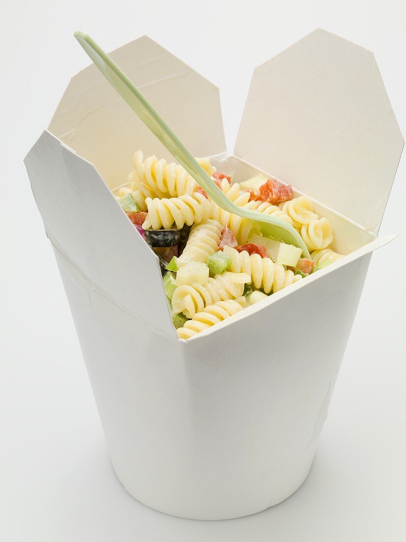 Fusilli with vegetables in take-away container