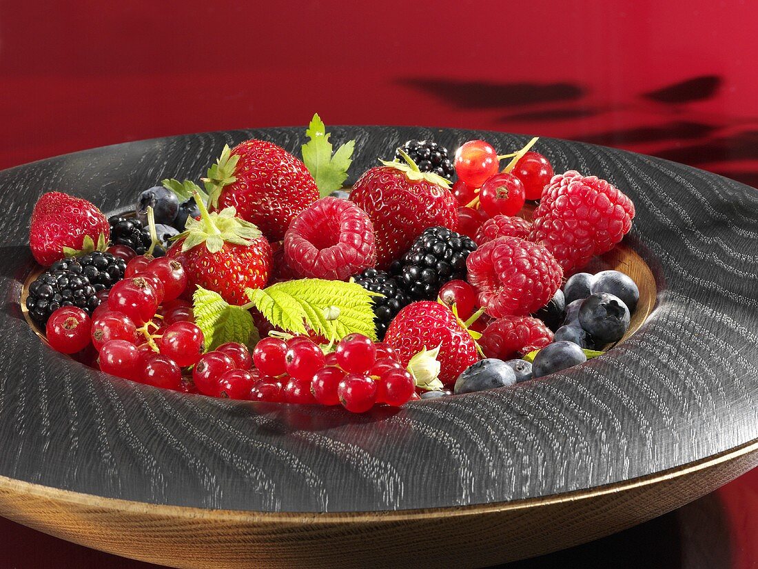 Assorted berries in wooden bowl