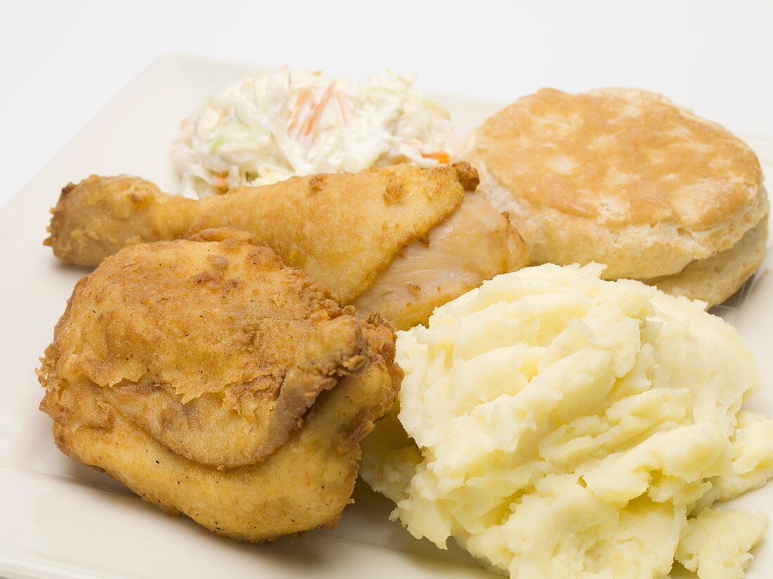 Fried chicken with mashed potato, coleslaw and scone